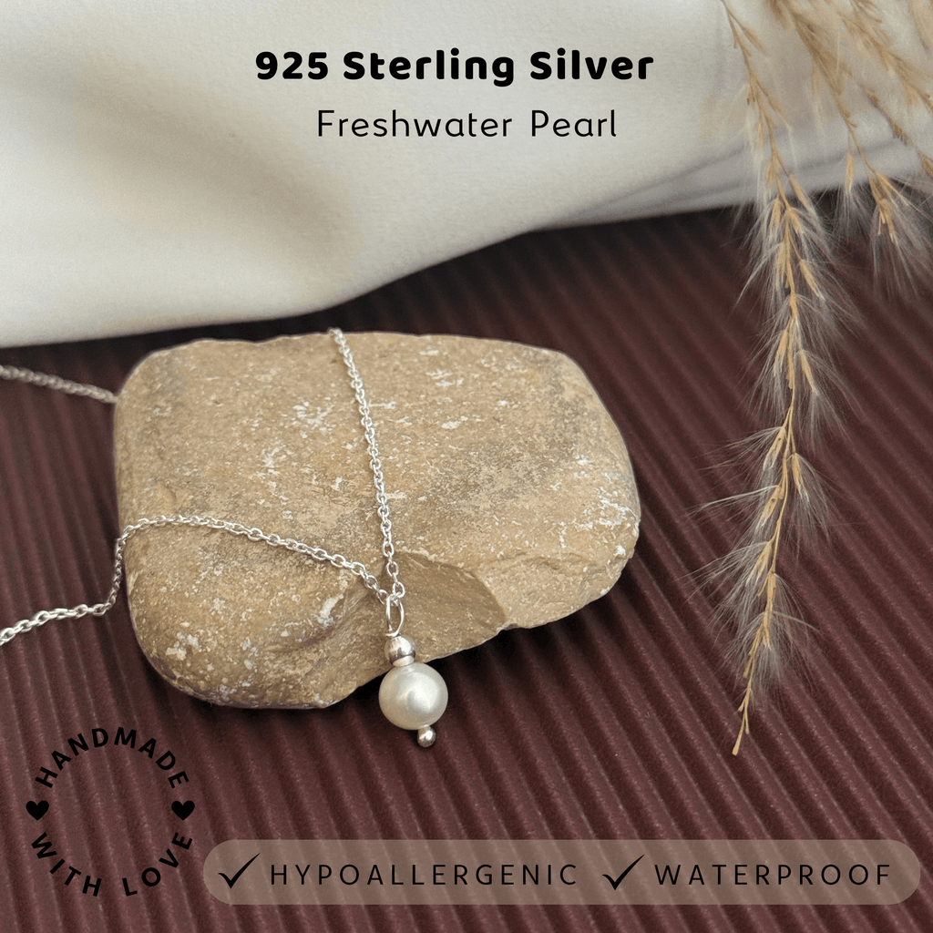 925 Sterling Silver Freshwater Pearl necklace on a stone