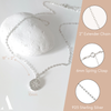 Necklace chain with a circle cz pendant set against a white background and a stone 