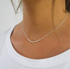 Sterling silver chain and beads on a woman 