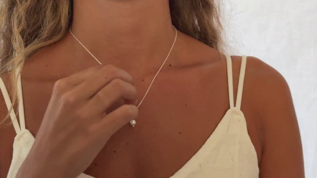 women wearing a pearl necklace with a sterling silver chain