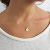 shiny Sterling silver necklace with a circle pendant with a simulated diamond for everyday look 